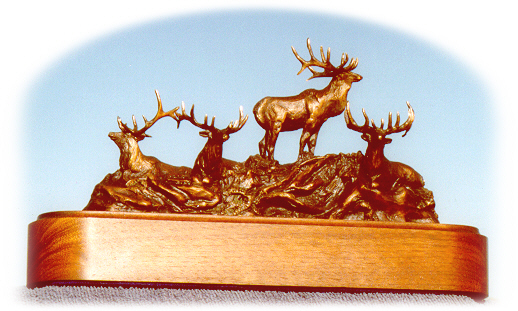 Bronze sculpture of four bull elk.