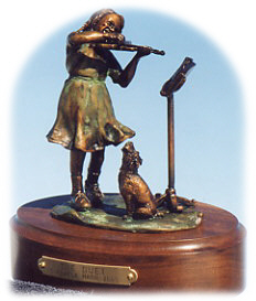 Bronze sculpture of a girl and her dog.