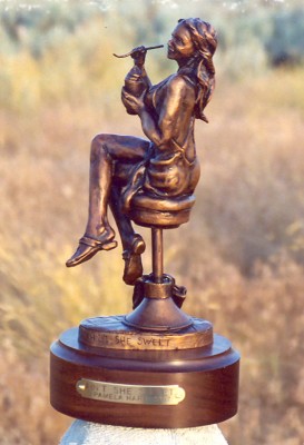 Bronze sculpture of sweet young woman.