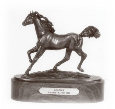 Bronze sculpture of a beautiful bay Arabian horse.