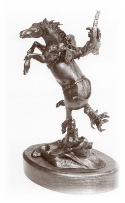 Bronze sculpture of a bareback bronc rider