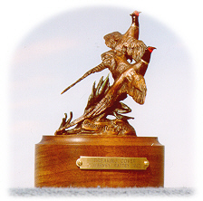 Bronze sculpture of pheasant hunting.