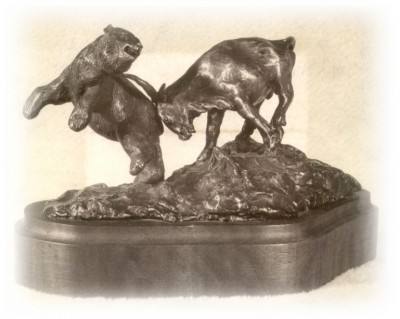 Bronze sculpture of a bull and bear fighting.
