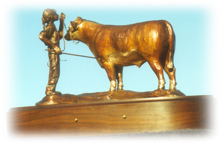 Bronze sculpture of girl and her Angus steer.