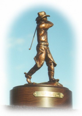 Bronze sculpture of cowboy golfing
