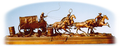 Bronze sculpture of chuckwagon team racing.