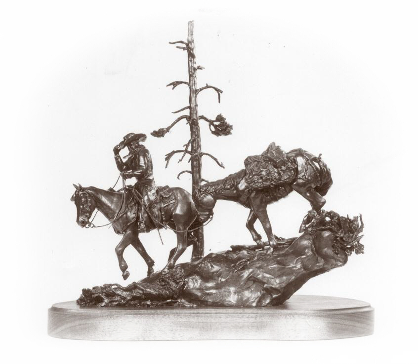 Bronze sculpture of cowboy packing down from mountains.