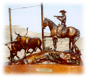 Bronze sculpture of a cowboy chasing cows through a gate.