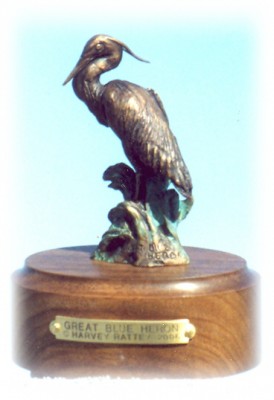 Bronze sculpture of great blue heron bird.