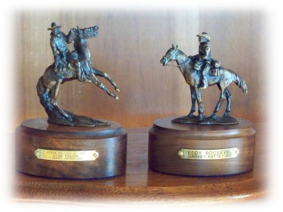 Separate bronze sculptures of a Horse Soldier and of Teddy Roosevelt the Roughrider
