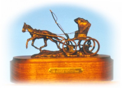 Bronze sculpture of horse pulling a doctor's buggy
