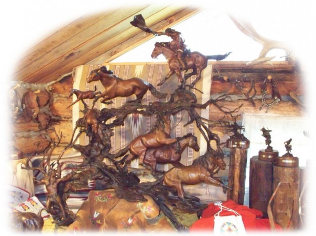 Bronze sculpture of Native Americans capturing horses.