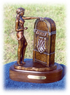 Bronze sculpture of young girl and a jukebox