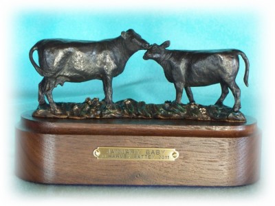 Bronze sculpture of an Angus cow and her big calf.