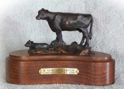 Bronze sculpture of Angus cow and her new calf.