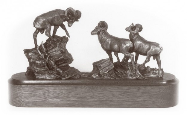 Bronze sculpture of bighorn rams.