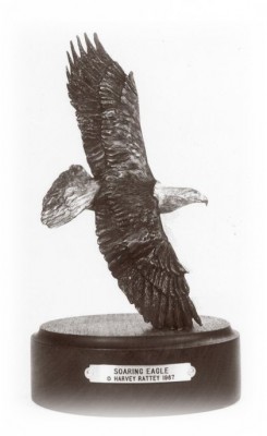 Bronze sculpture of a soaring eagle.
