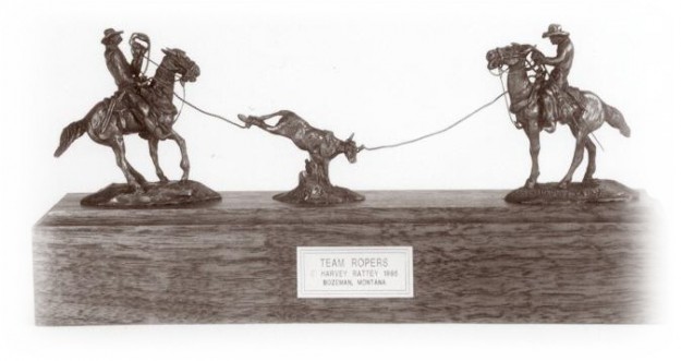 Bronze sculpture of team ropers.