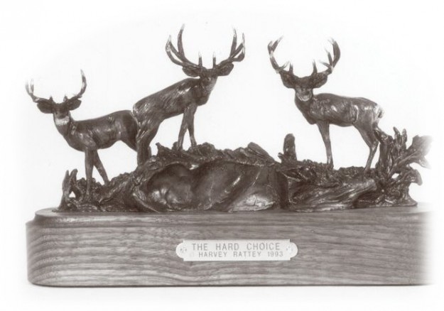 Bronze sculpture of three atypical mule deer bucks.