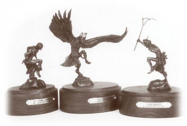 Bronze sculptures of Native American dancers.