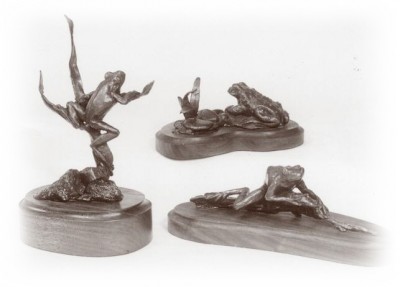 Bronze sculptures of frogs and toads.