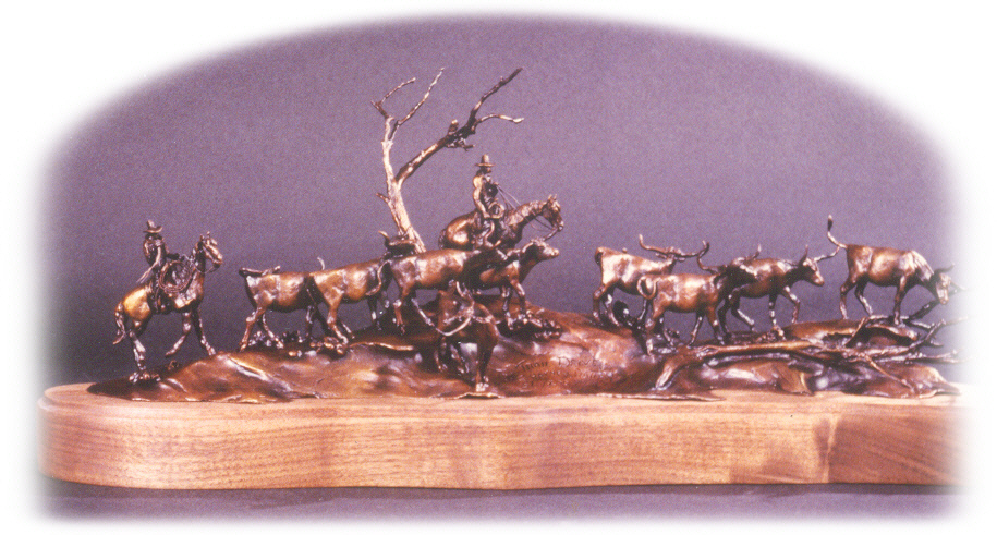 Bronze sculpture of horseback cowboy trailing cattle