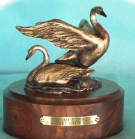 Bronze sculpture of trumpeter swans.