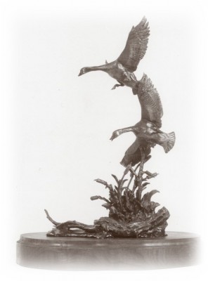 Bronze sculpture of two geese.