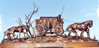 Bronze sculpture of chuch wagon, team of horses.