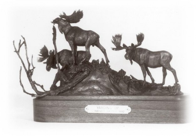 Bronze sculpture of three bull moose.