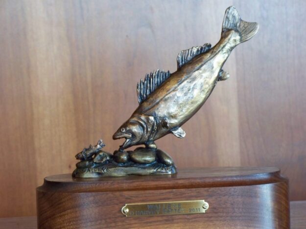 Bronze sculpture of a walleye diving for prey.