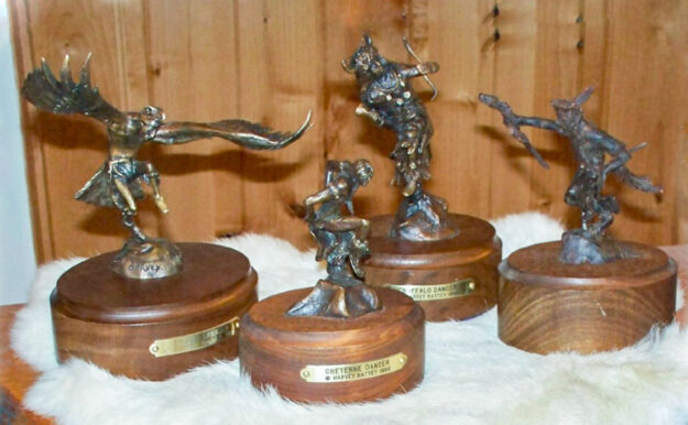 Four bronze Bronze sculptures of Native American dancers