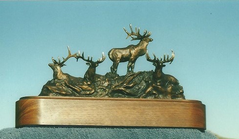 Bronze sculpture of four bull elk.