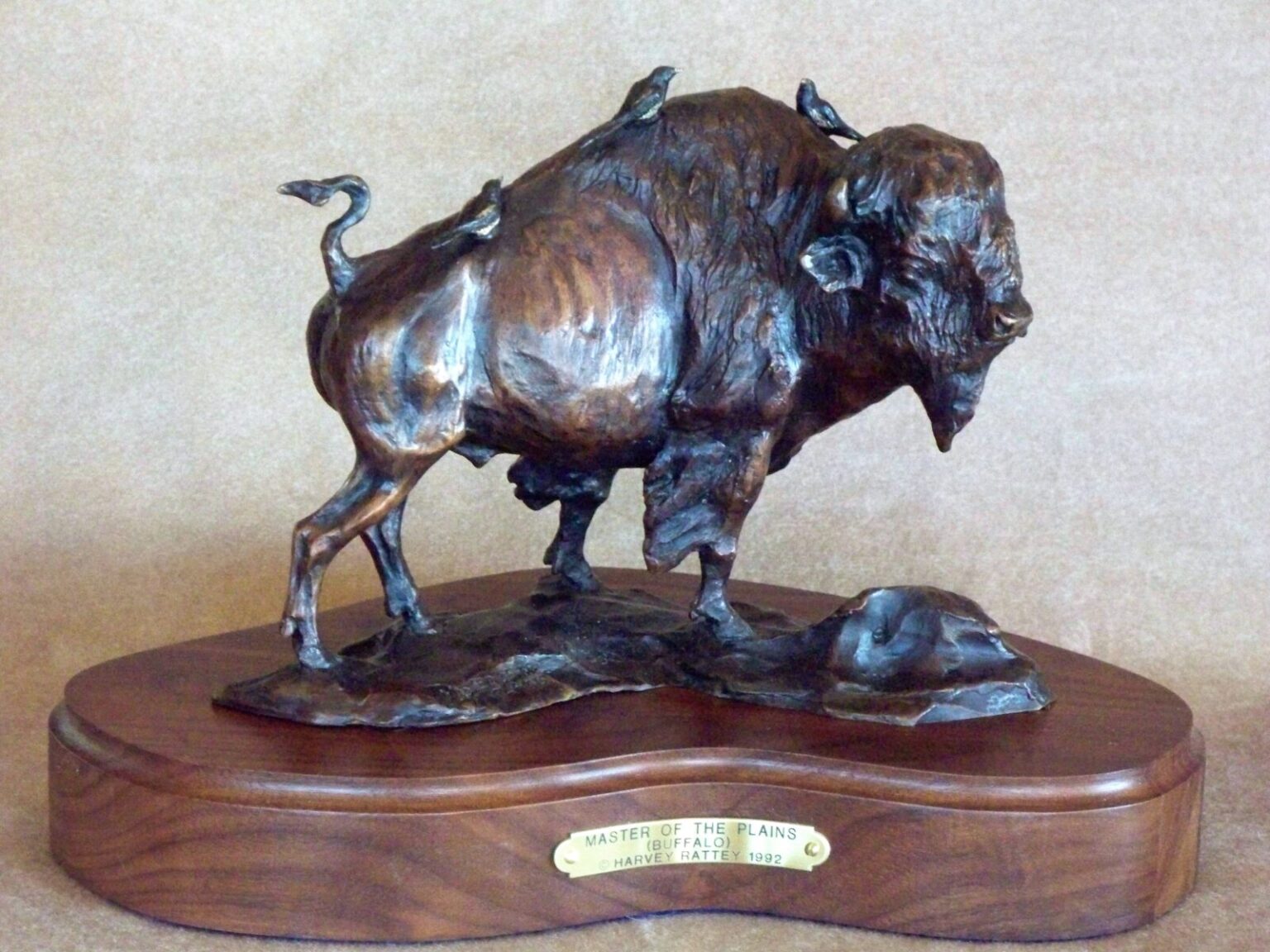 Bronze sculpture of a bison bull.