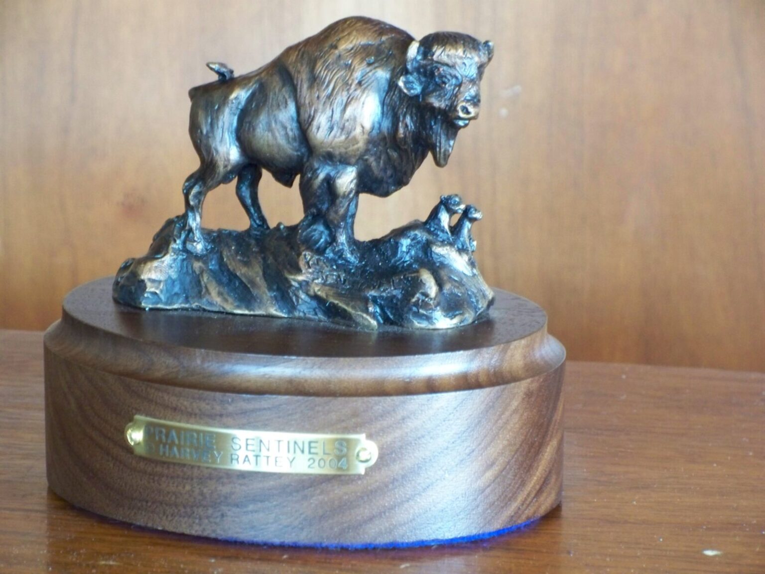 Bronze sculpture of an adult American bison bull.