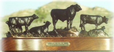 Bronze sculpture of Angus cows and a bull.