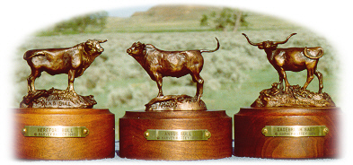 Bronze sculptures of a Hereford bull, Angus bull, and a Longhorn cow and calf.