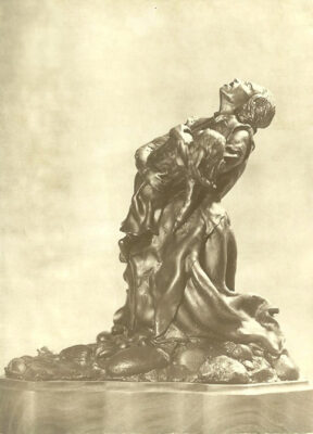 Older advertising photo of the first of sculpture of The Price.  Left side view.