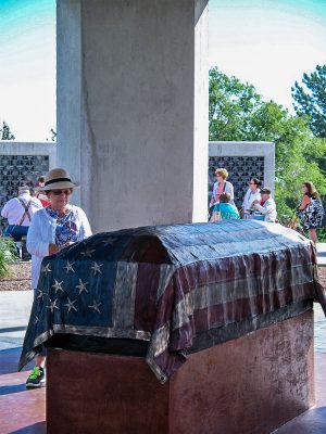 Casket with American flag sculpture