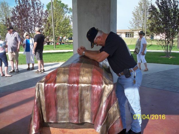 Flag Draped Casket by Pamela Harr Northeastern Plains Veterans Memorial, Ft. Peck, MT
