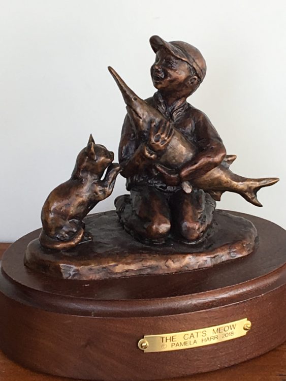 The-Cats-Meow-by-Pamela-Harr - bronze sculpture of little boy, his paddlefish, and his cat