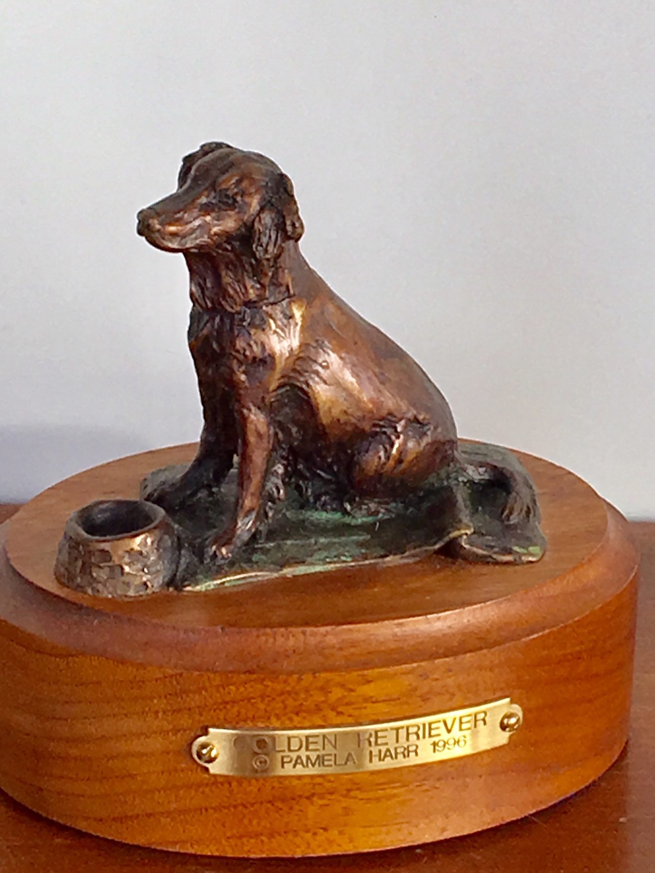 Small bronze sculpture of a sitting Golden Retriever