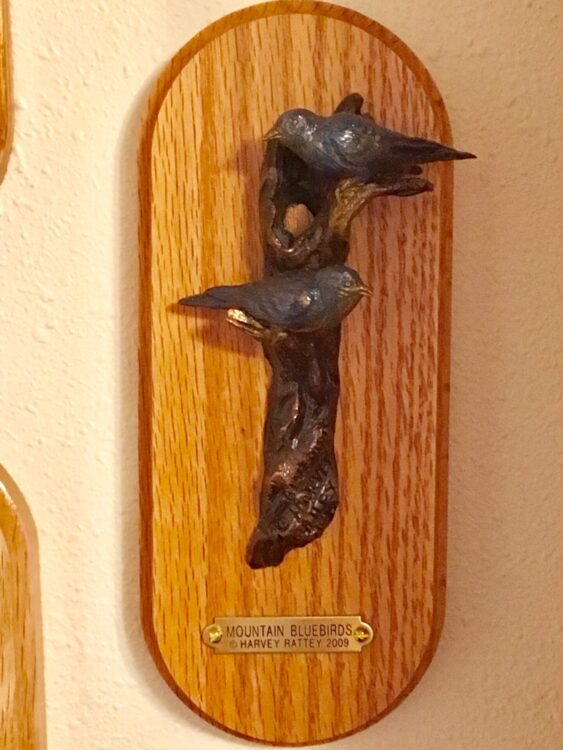 Small bronze sculpture of 2 bluebirds.