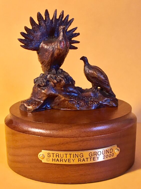 Bronze sculpture of a male Greater Sage-Grouse dancing to impress a hen.